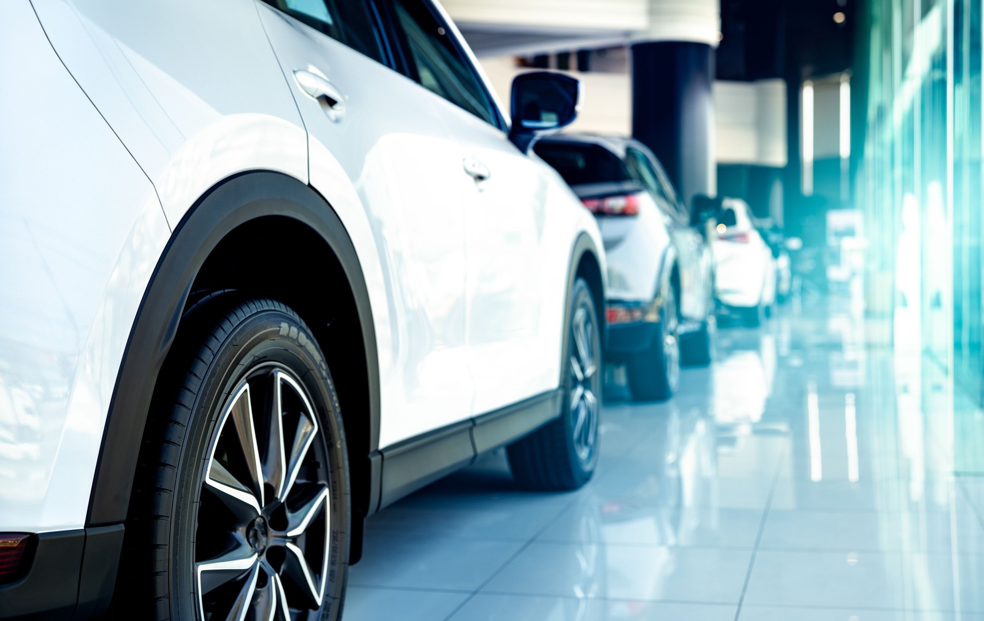 Car parked in luxury showroom. Car dealership office. Car showroom business. New car parked in modern showroom. Auto for sale and rent business. Automobile leasing and insurance. Electric automobile.